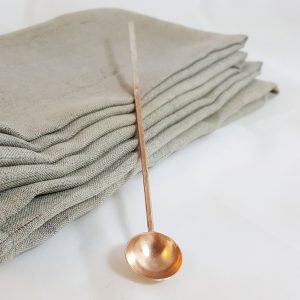 An image of the copper spoon with the silvered handle