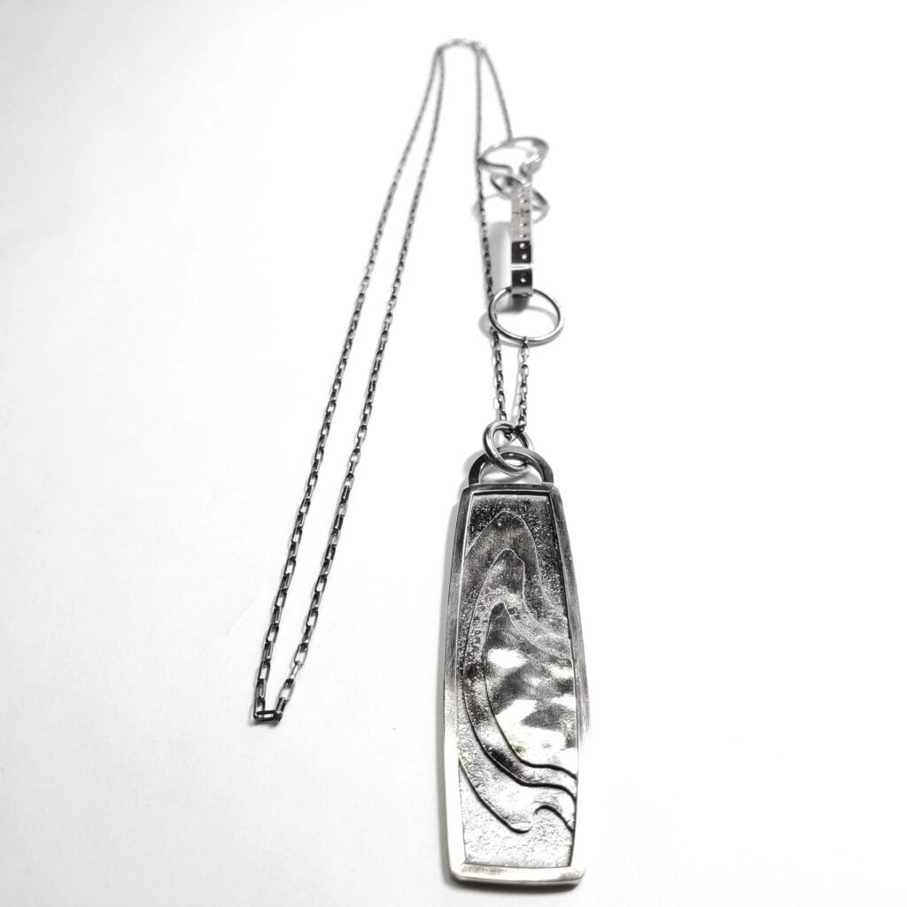 A foreshortened view of the elongated terrain pendant to emphasize the textures.