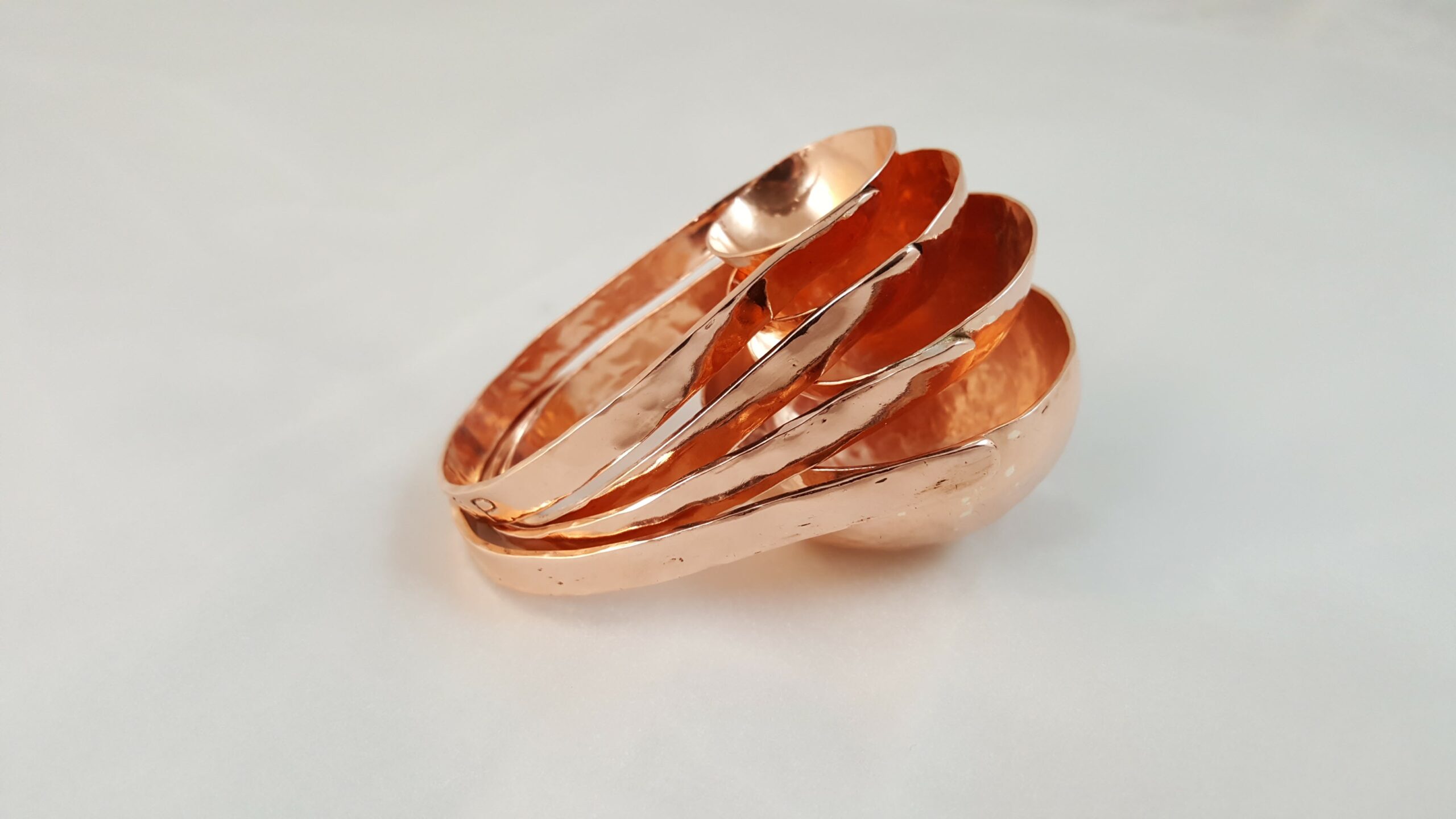 copper measuring spoons