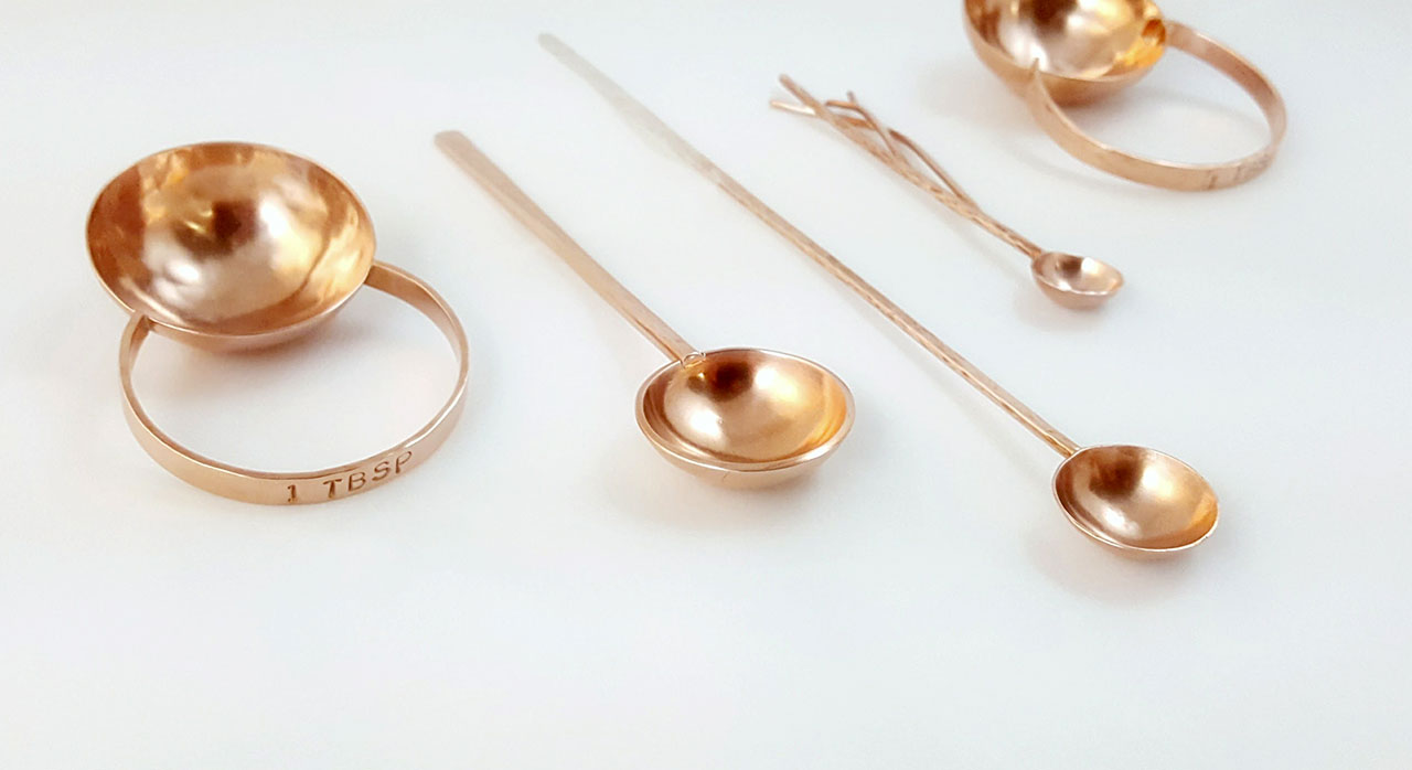 Copper spoons of various sizes