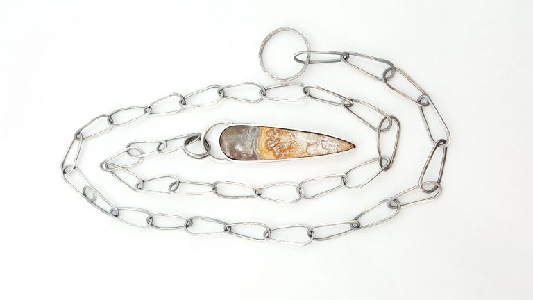 A view of the Crazy Lace and sterling silver lariat from above.