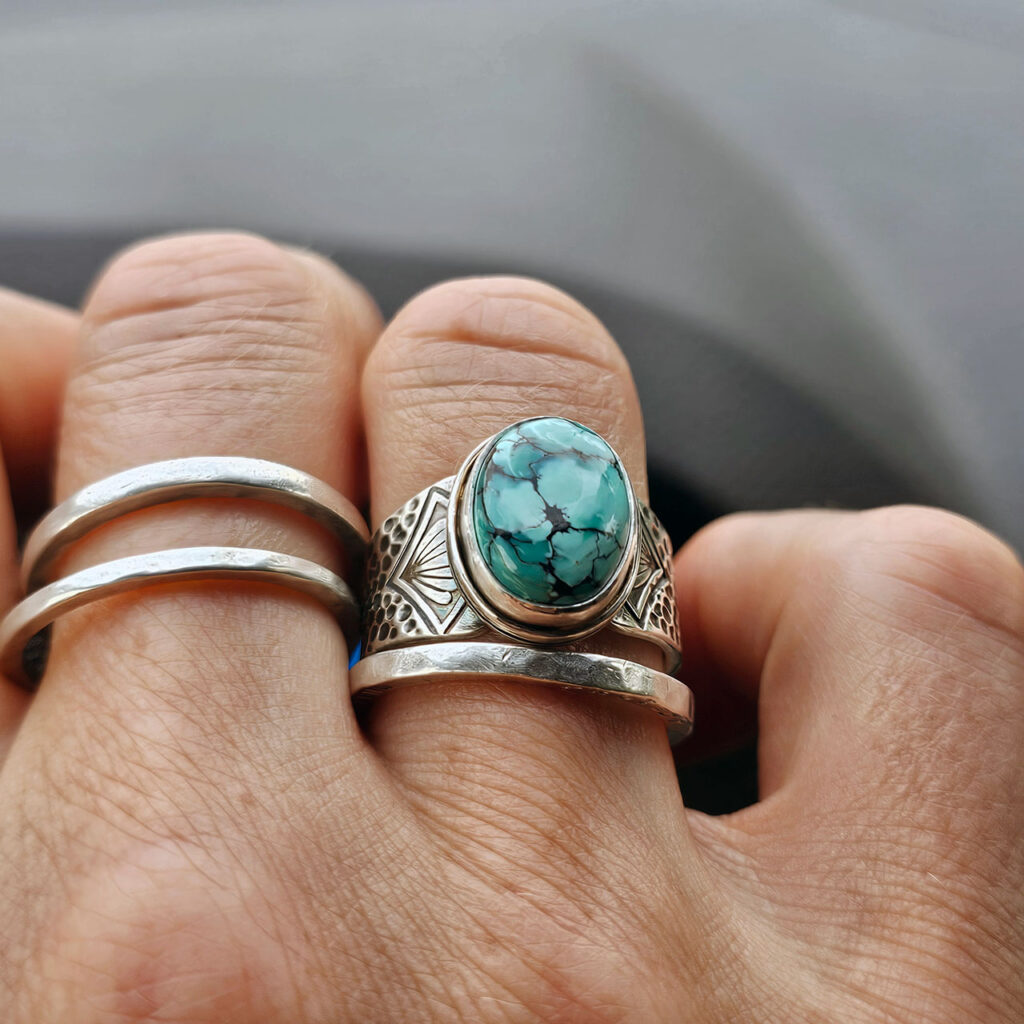 A stamped turquoise ring