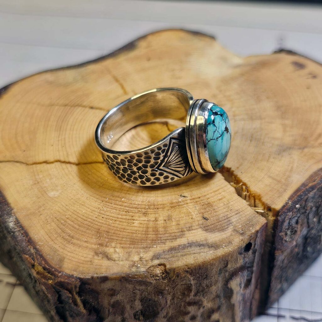 A stamped turquoise ring