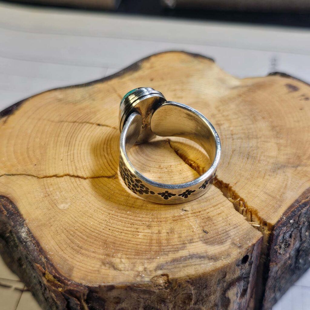 A stamped turquoise ring