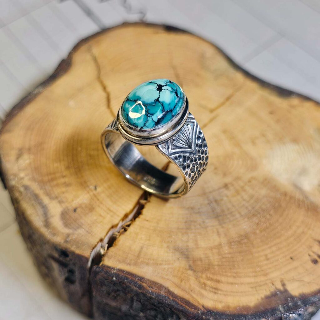 A stamped turquoise ring