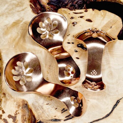 CopperCondimentSpoon2-Folk Three copper condiment spoons on a wood surface