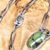 GreenTurquoiseNecklaceClose-opt A green turquoise pendant on a handmade silver chain. A Prehenite cabochon is set in the chain to accent the green of the turquoise