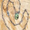 GreenTurquoiseNecklaceFeature-opt The handmade chain and green turquoise cabochon set in silver. Nearby on the chain is the smaller rultilated prehenite.