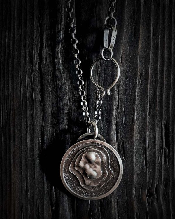 WinterLandscape3-opt The pendant hanging on a black wood background