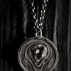 The pendant hanging on a black wood background